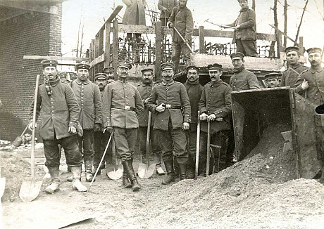 German pioneers posing in front of a concrete fortification under construction in Prémesques, 1916 /